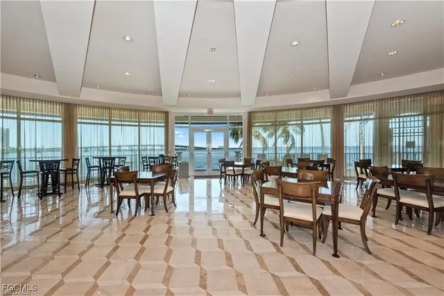a view of a dining area with furniture and chandelier
