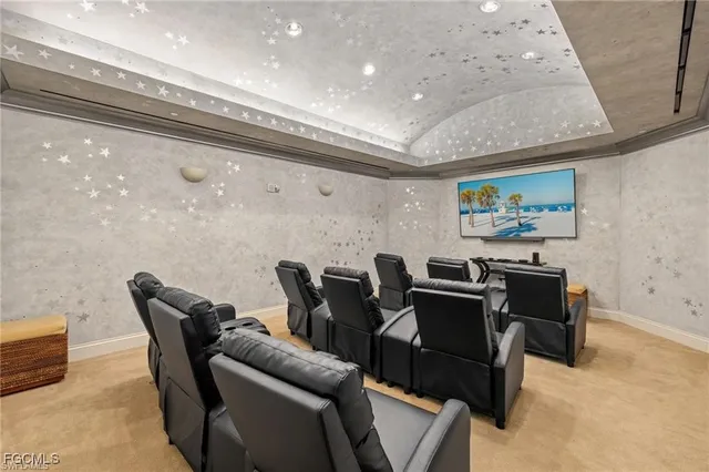 a dining room with furniture and a floor to ceiling window