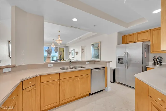 a kitchen with a sink and refrigerator