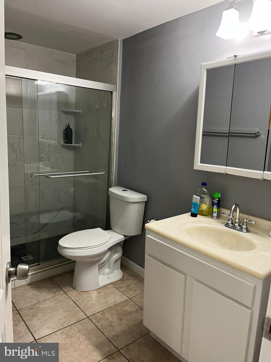 3715 Falls Road, Unit 4 Baltimore, MD 21211 - Photo 3 of 17 a white toilet sitting next to a bathroom sink