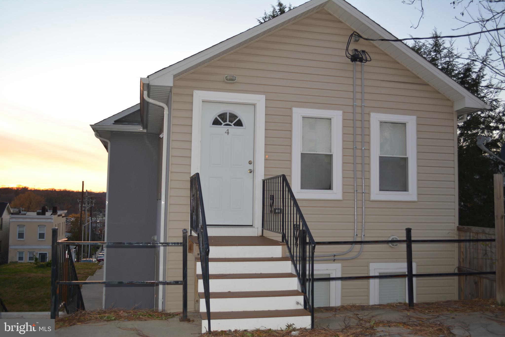 3715 Falls Road, Unit 4 Baltimore, MD 21211 - Photo 7 of 17 a front view of a house with stairs