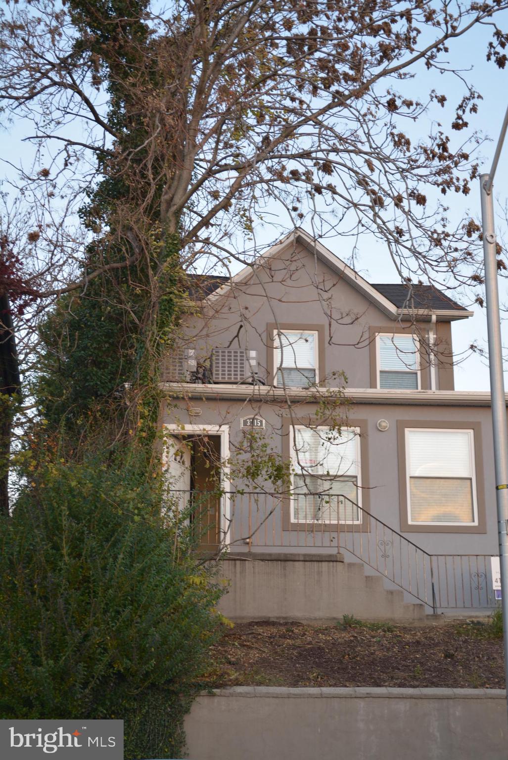 3715 Falls Road, Unit 4 Baltimore, MD 21211 - Photo 9 of 17 front view of a house with a tree