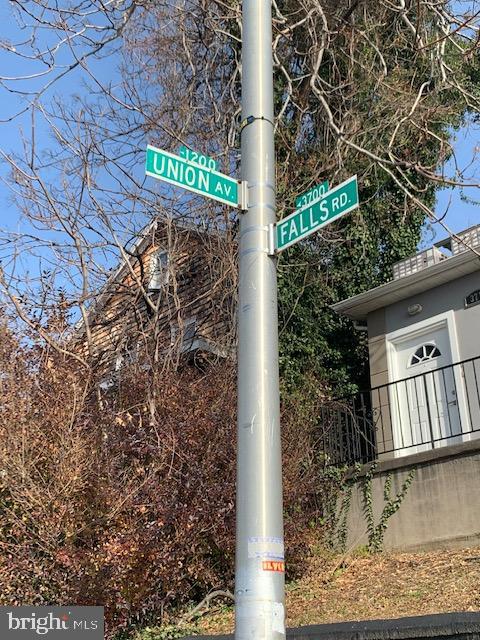 3715 Falls Road, Unit 4 Baltimore, MD 21211 - Photo 10 of 17 a sign that is on the side of a road
