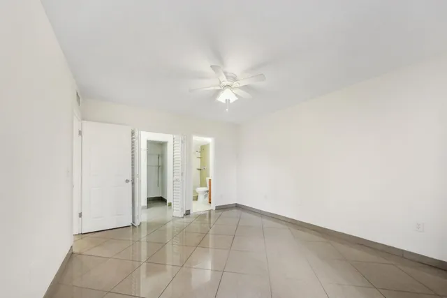 a bathroom with a sink toilet vanity and shower