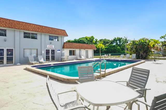 a view of a swimming pool with a patio
