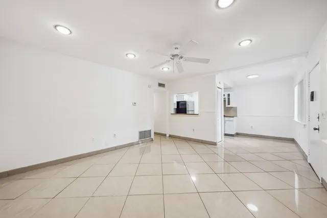 an empty room with white walls