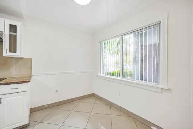 a kitchen with stainless steel appliances granite countertop a sink and a stove