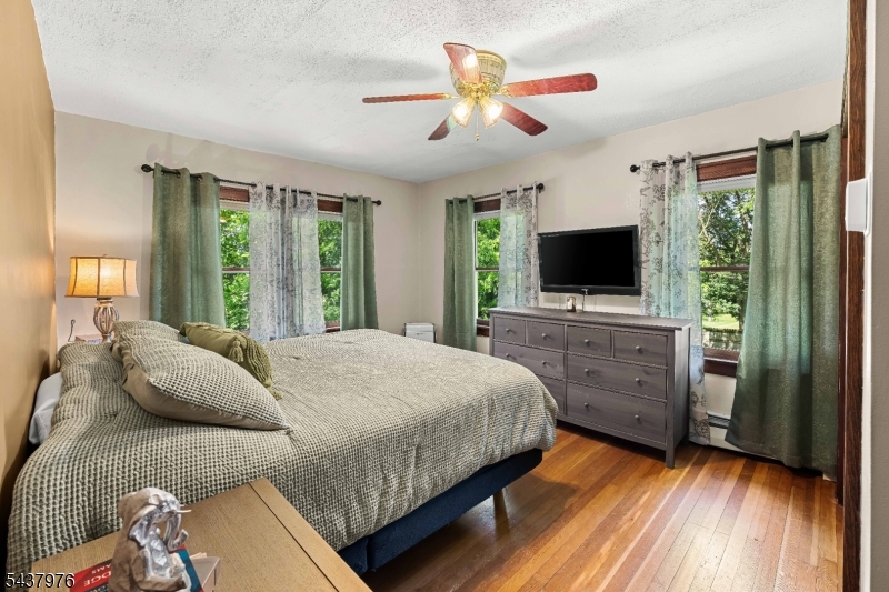 886 Brass Castle Road Belvidere, NJ 07823 - Photo 19 of 44 a bedroom with a bed and a flat screen tv