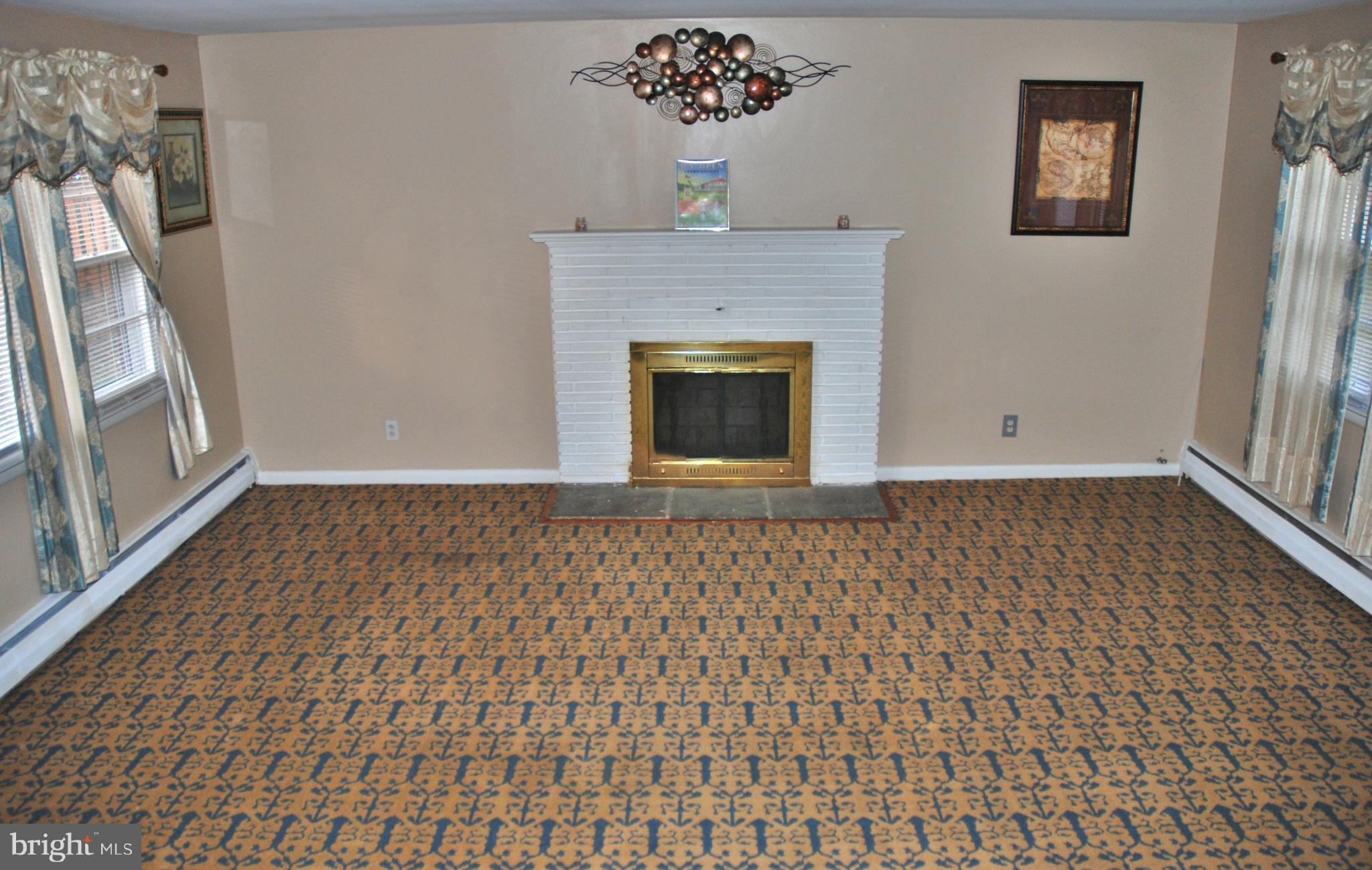 814 Providence Road Baltimore, MD 21286 - Photo 9 of 30 Front & back picture windows with fireplace