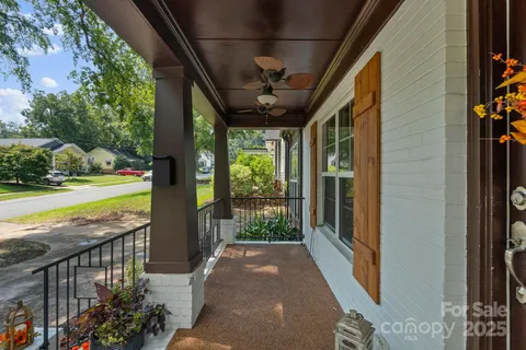 a view of a porch with furniture and garden