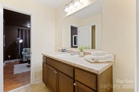 a living room with furniture couches and a flat screen tv