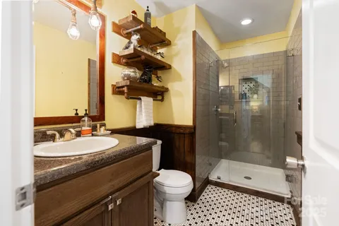 an aerial view of a house with a garden and swimming pool