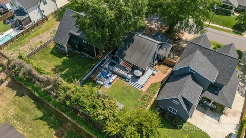 a view of a house with swimming pool and sitting area