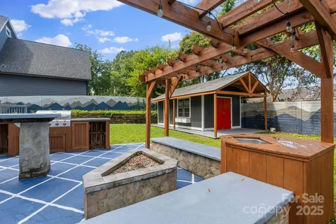 a view of a house with a yard and sitting area