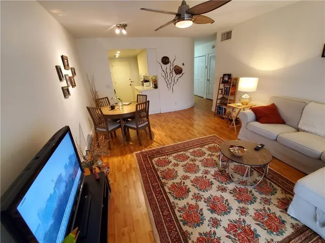 a living room with furniture and a rug