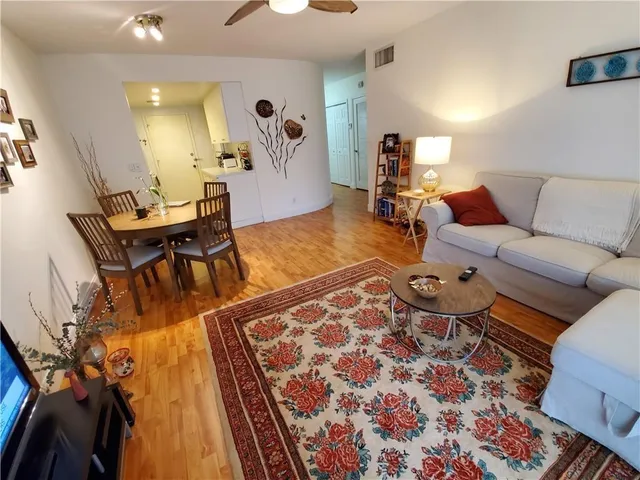 a living room with furniture and a rug