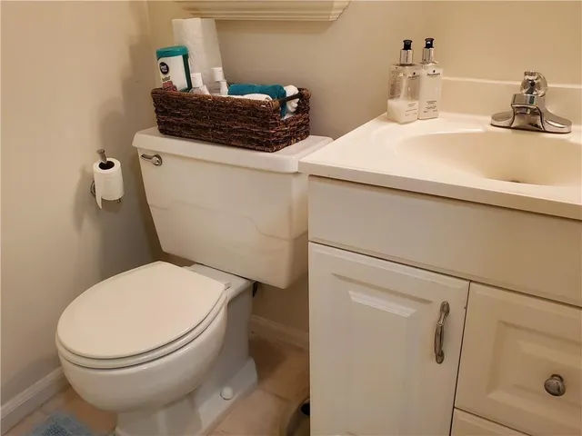 a bathroom with a toilet and a sink