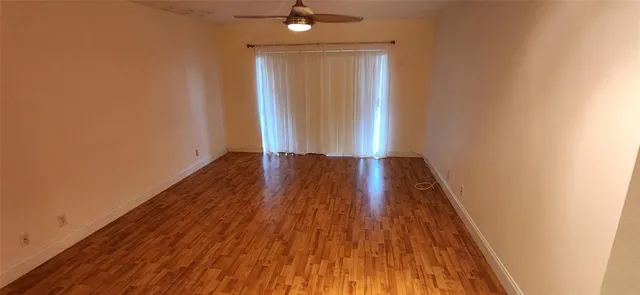 a view of wooden floor in an empty room