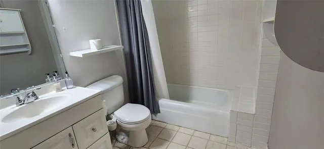 a bathroom with a sink a toilet and bathtub