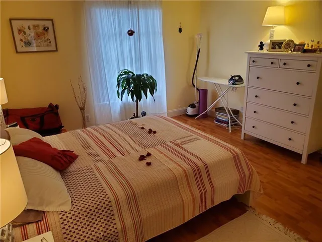 a bedroom with a bed and furniture