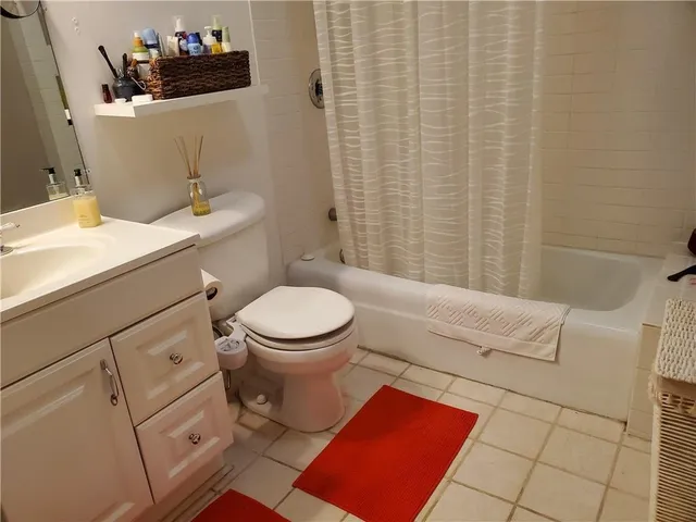a bathroom with a toilet and a sink