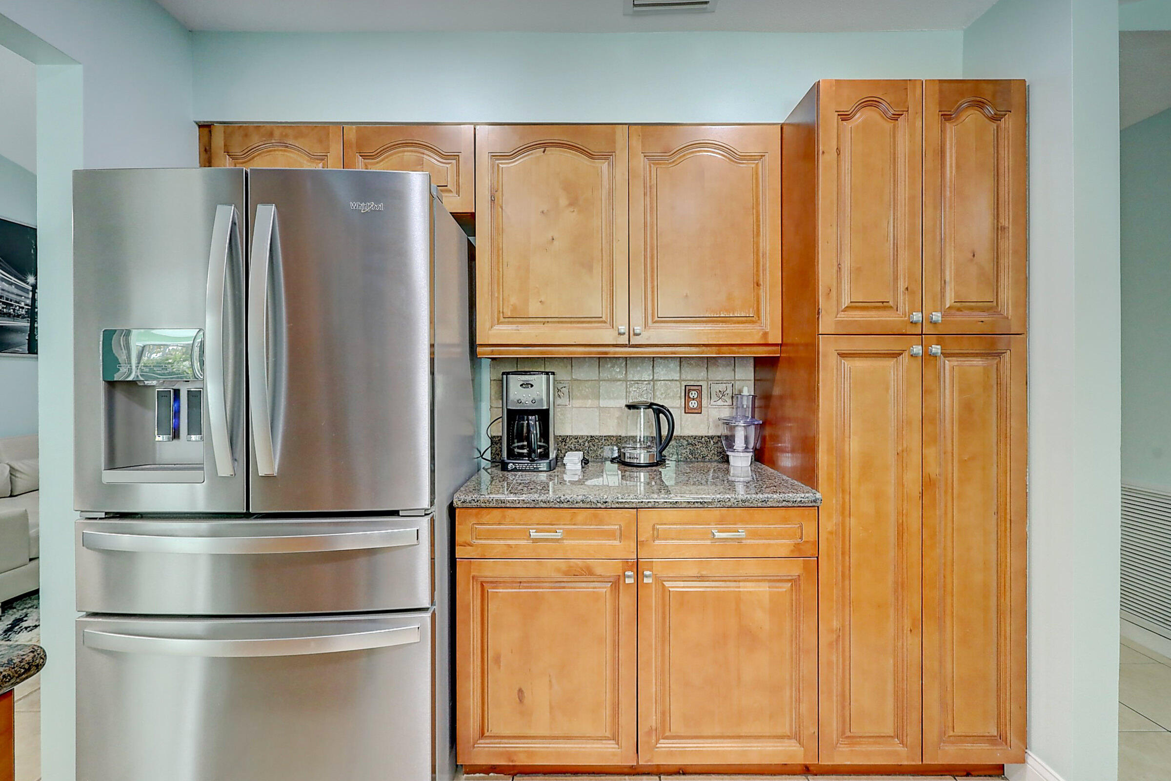 238 Southwest Grove Avenue Port St. Lucie, FL 34983 - Photo 13 of 47 a kitchen with stainless steel appliances granite countertop a refrigerator and a stove top oven