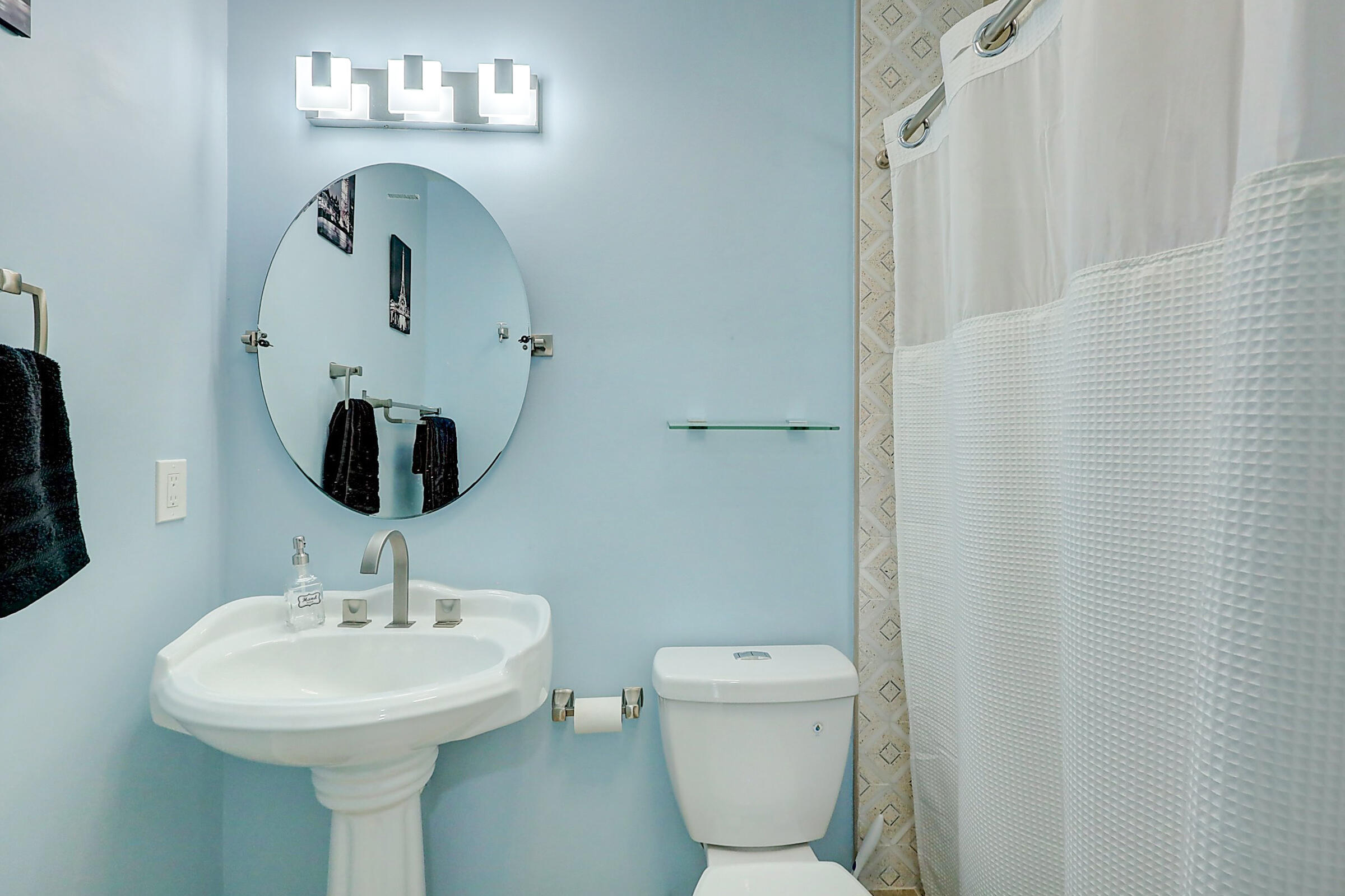 238 Southwest Grove Avenue Port St. Lucie, FL 34983 - Photo 27 of 47 a bathroom with a toilet sink and mirror