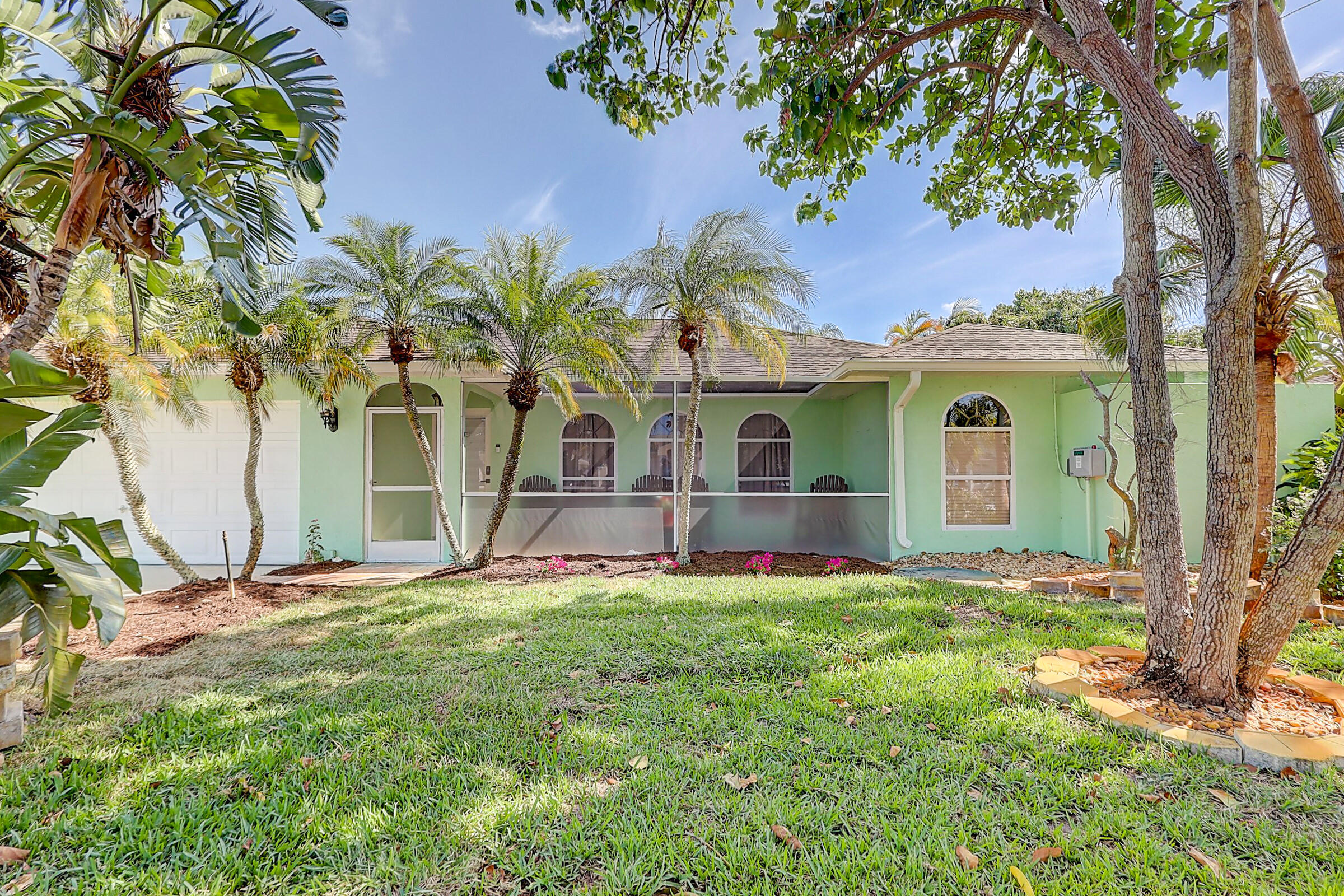 238 Southwest Grove Avenue Port St. Lucie, FL 34983 - Photo 3 of 47 a view of front of house with a yard