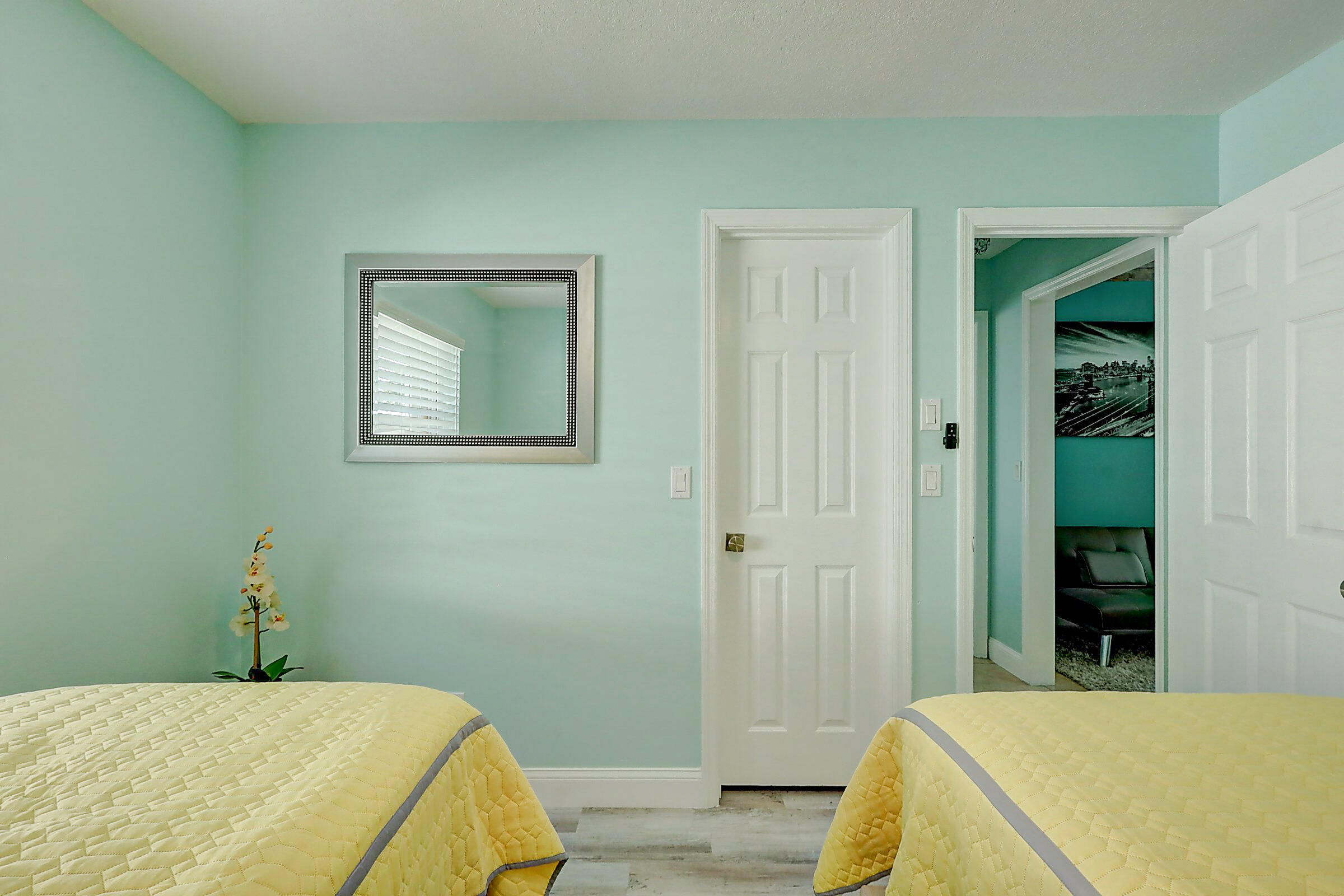 238 Southwest Grove Avenue Port St. Lucie, FL 34983 - Photo 31 of 47 a bedroom with a bed and a table