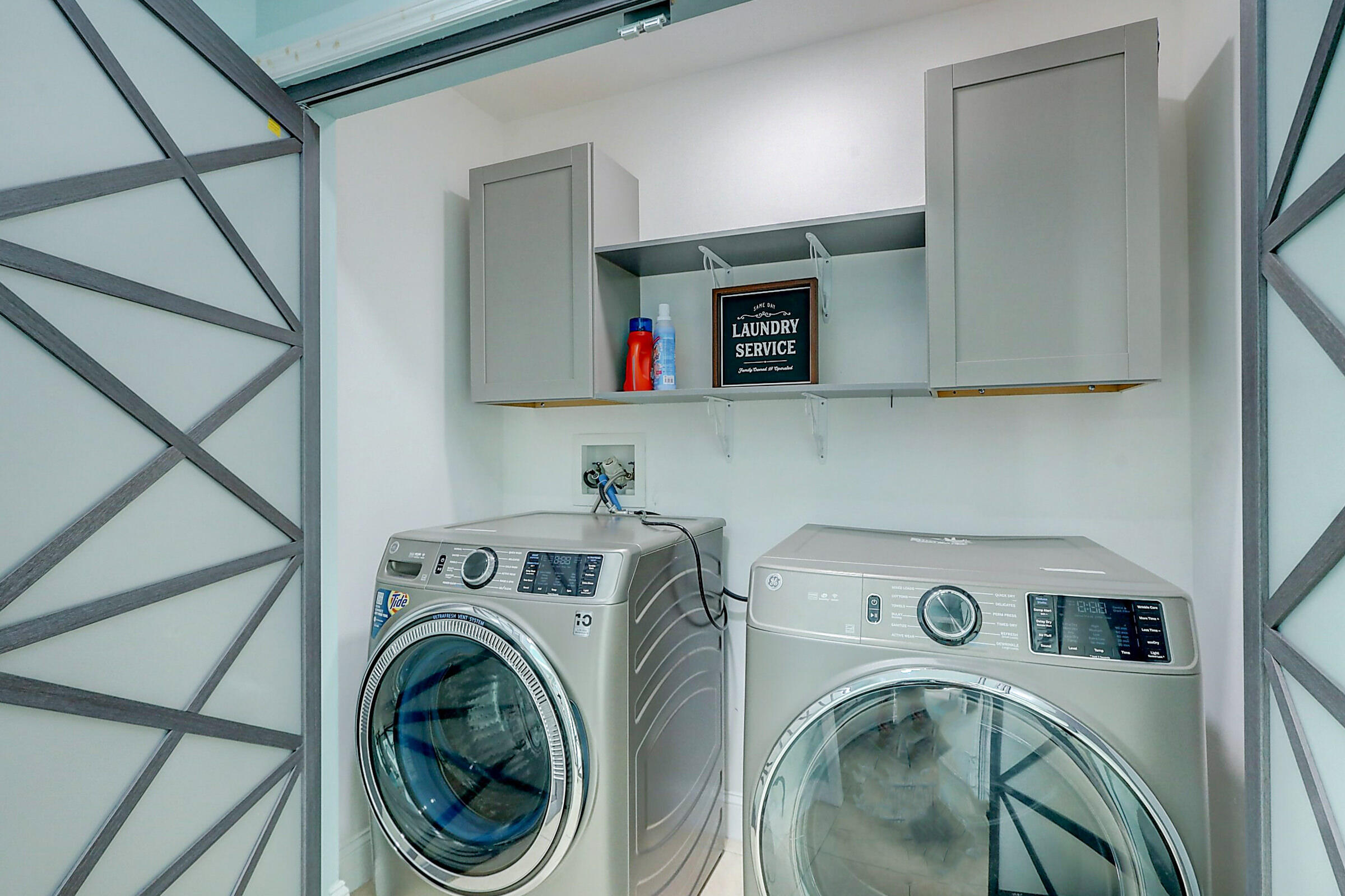 238 Southwest Grove Avenue Port St. Lucie, FL 34983 - Photo 32 of 47 a utility room with dryer and washer