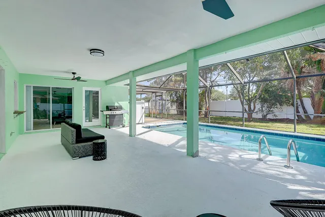 a view of swimming pool with a yard