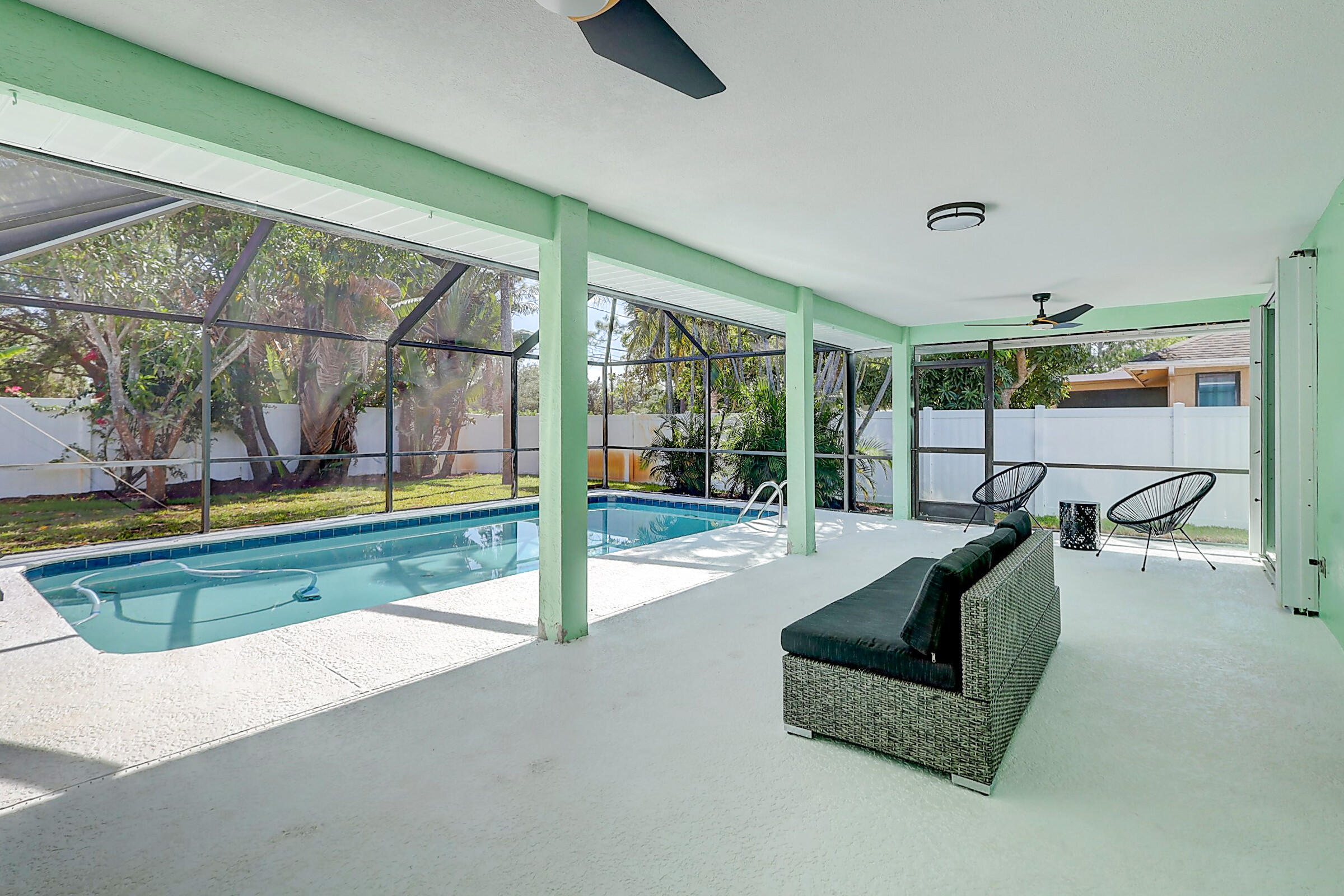 238 Southwest Grove Avenue Port St. Lucie, FL 34983 - Photo 36 of 47 a swimming pool with outdoor seating and yard