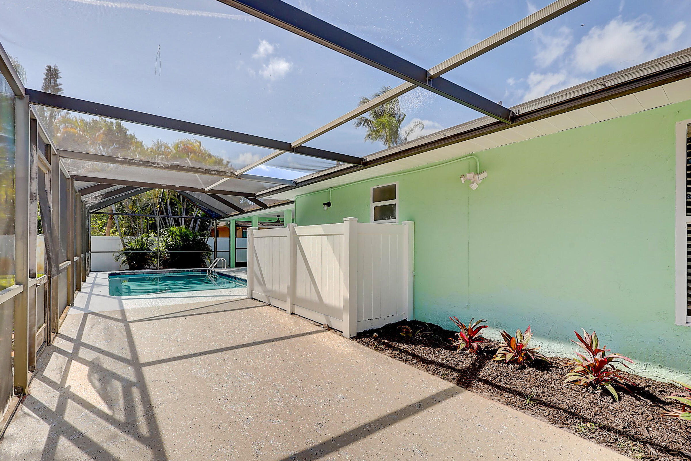 238 Southwest Grove Avenue Port St. Lucie, FL 34983 - Photo 40 of 47 a bedroom with a bed and a mirror