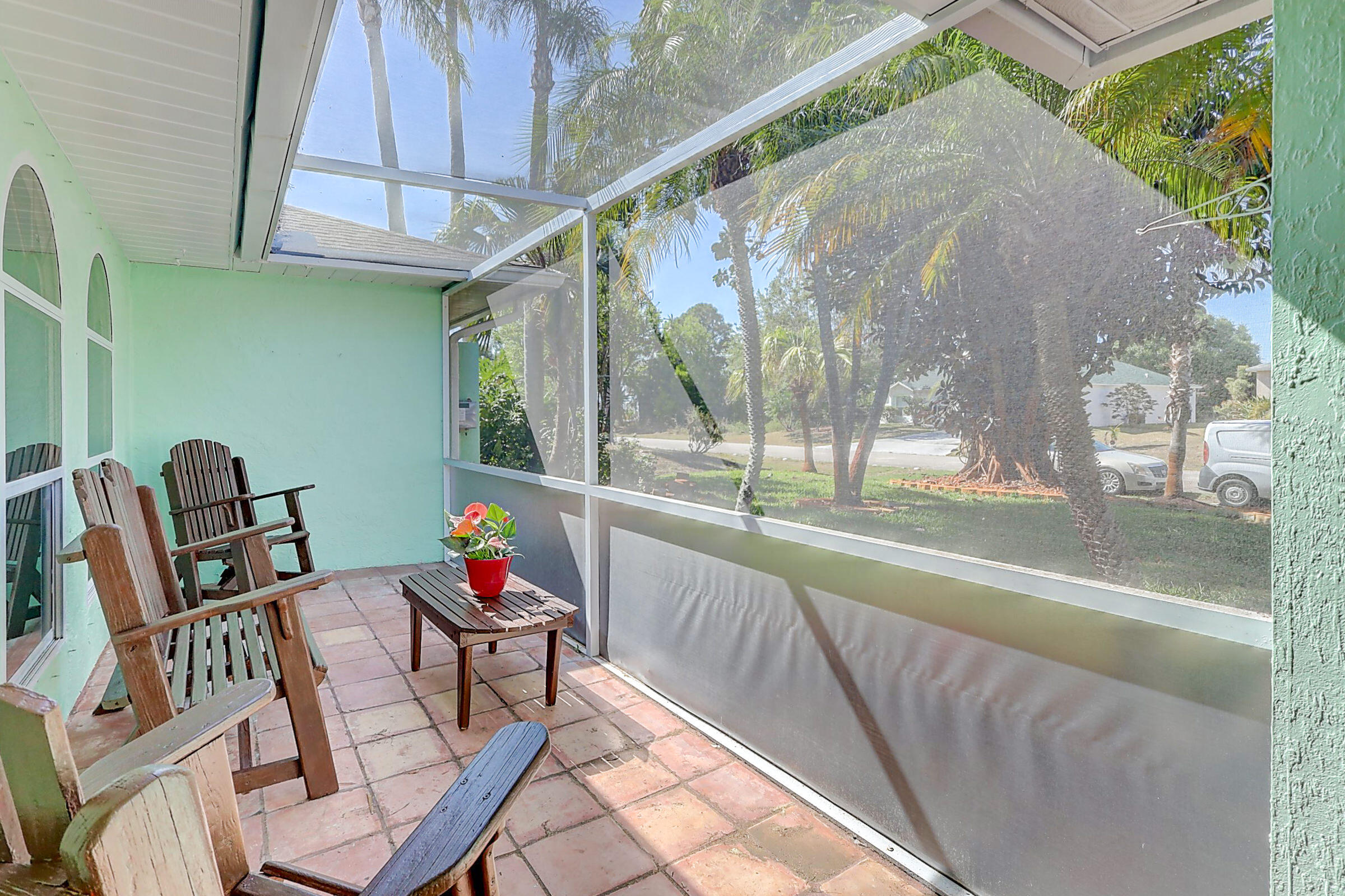 238 Southwest Grove Avenue Port St. Lucie, FL 34983 - Photo 43 of 47 a sitting area with furniture and wooden deck