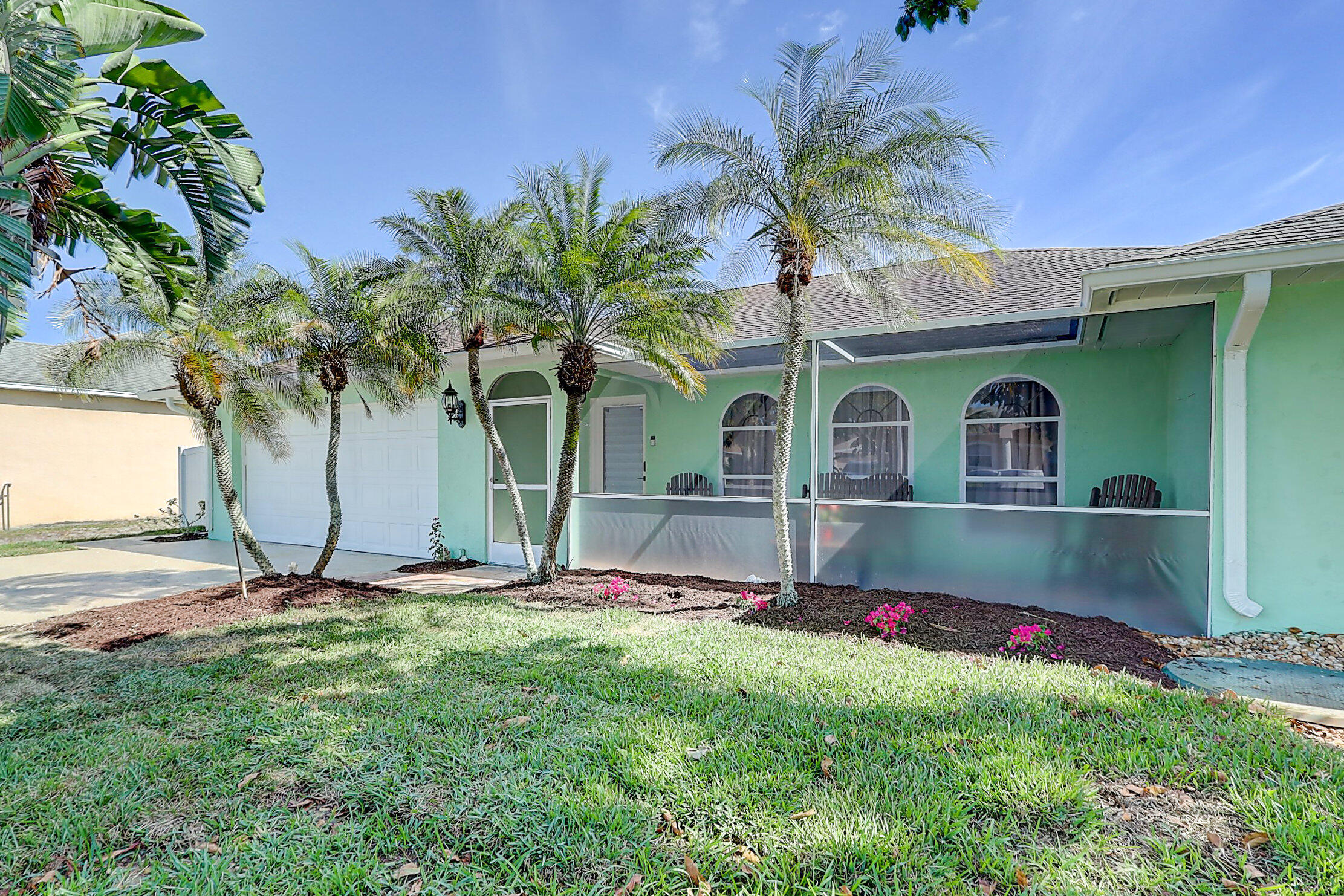 238 Southwest Grove Avenue Port St. Lucie, FL 34983 - Photo 46 of 47 a front view of house with yard and outdoor seating
