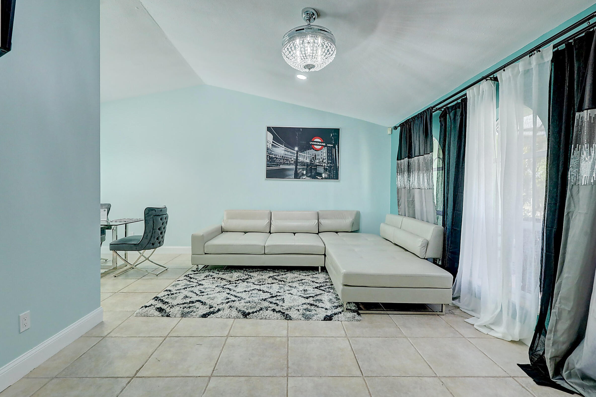 238 Southwest Grove Avenue Port St. Lucie, FL 34983 - Photo 5 of 47 a living room with furniture and a window