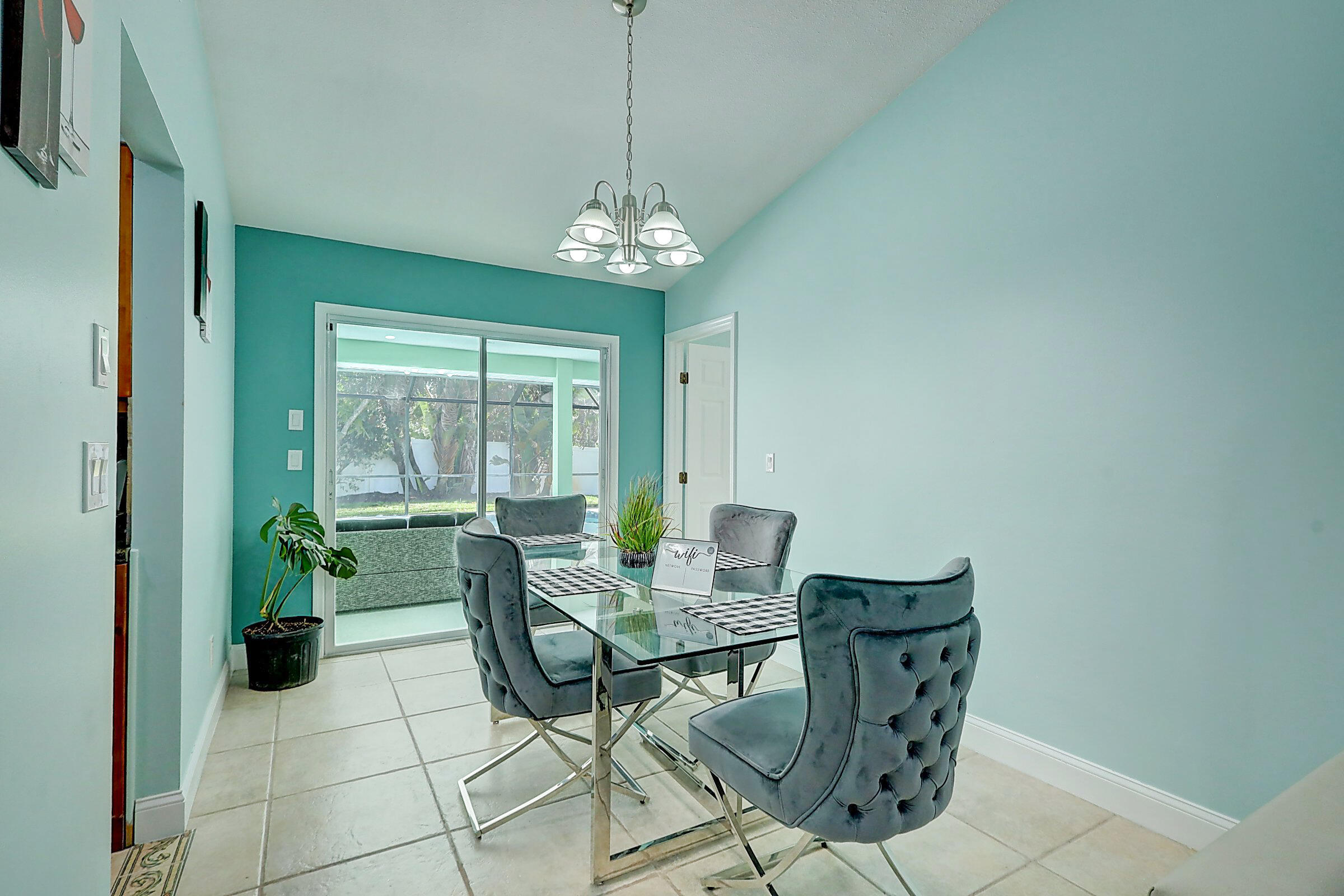 238 Southwest Grove Avenue Port St. Lucie, FL 34983 - Photo 8 of 47 a view of a dining room with furniture window and outside view