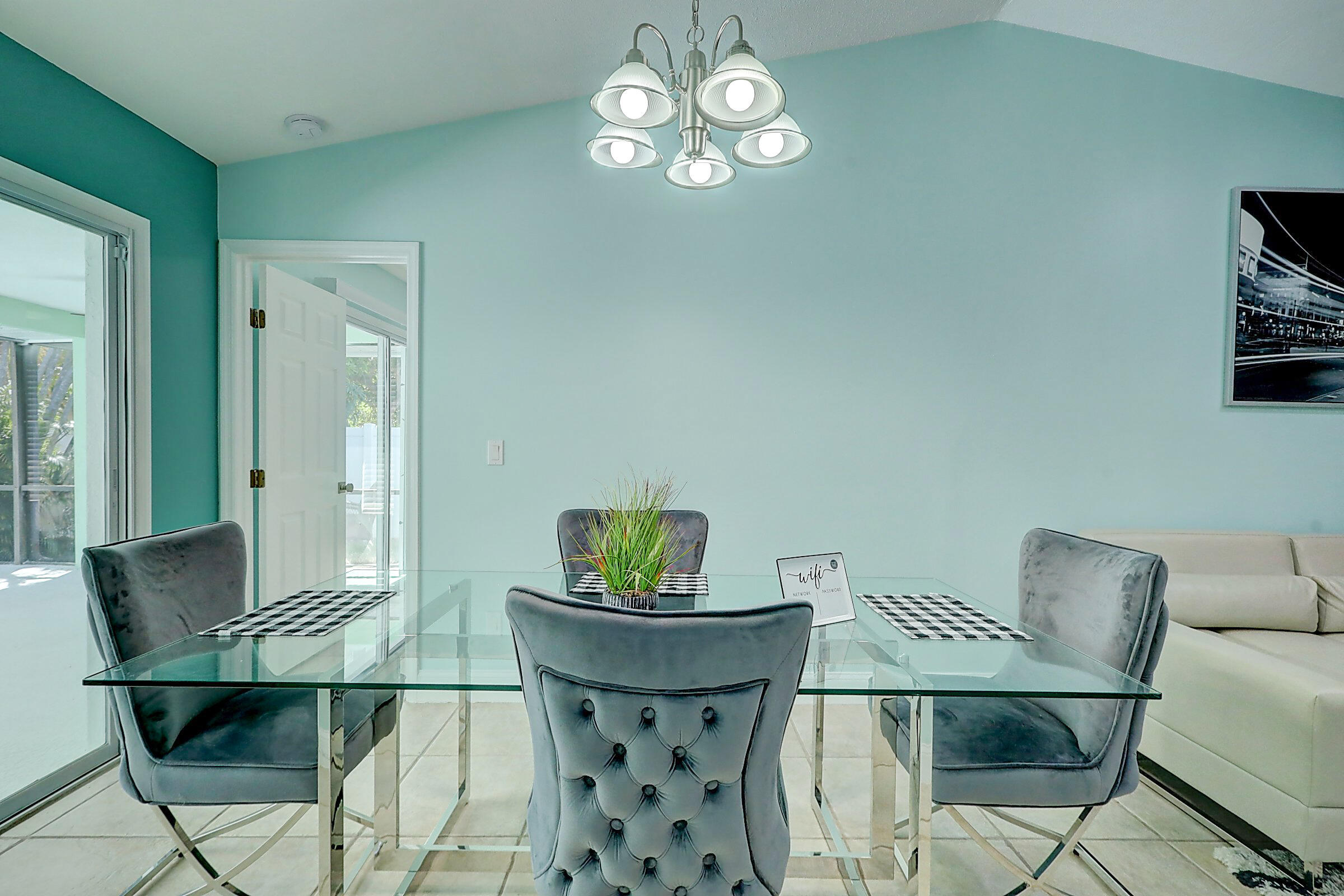 238 Southwest Grove Avenue Port St. Lucie, FL 34983 - Photo 9 of 47 a view of a dining room with furniture and wooden floor