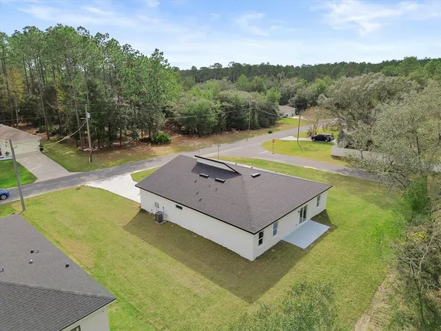 a view of a patio with a table and chairs