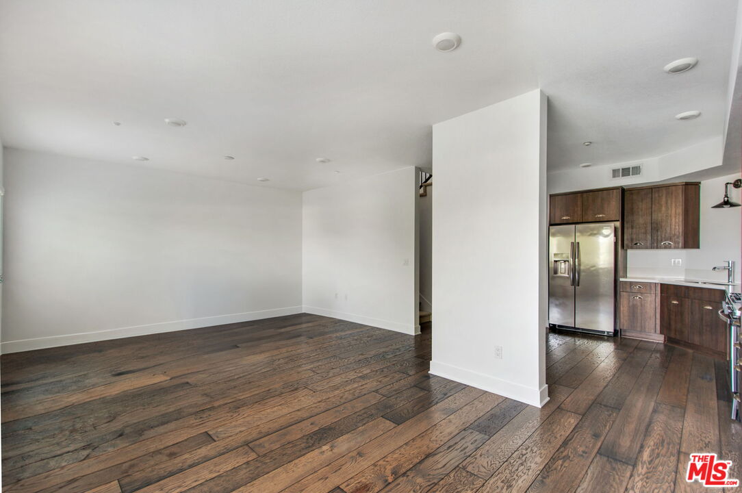 2974 Ripple Place, Unit 203 Los Angeles, CA 90039 - Photo 12 of 29 a view of a kitchen with wooden floor and a sink