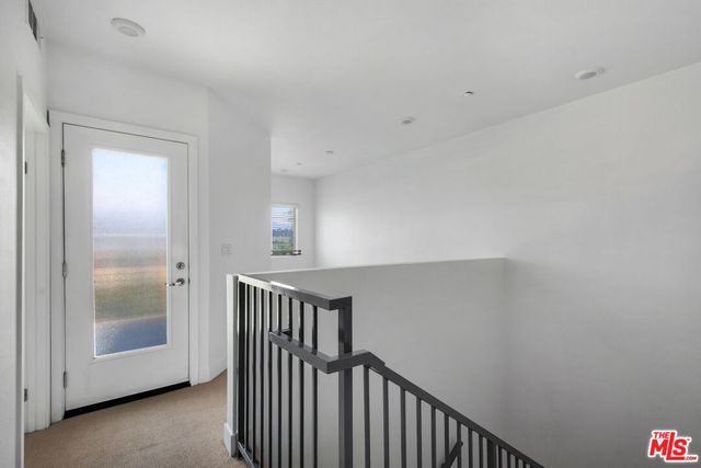 a view of a room that has a window in it