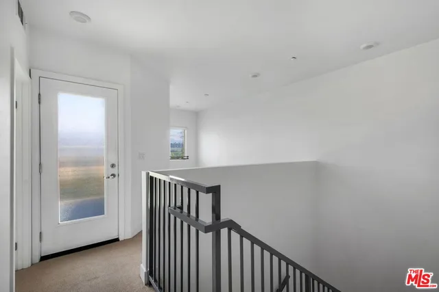 a view of a room that has a window in it