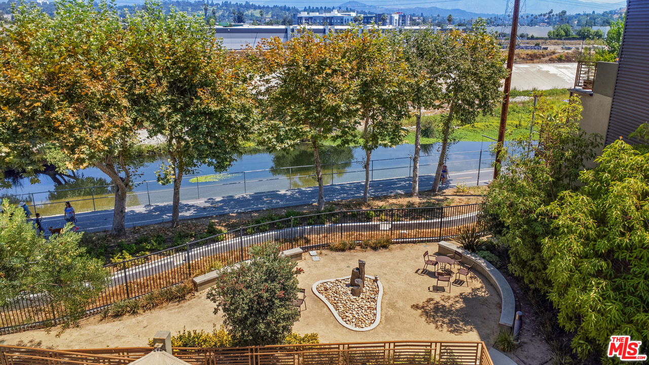 2974 Ripple Place, Unit 203 Los Angeles, CA 90039 - Photo 2 of 29 a view of a backyard with plants and a garden