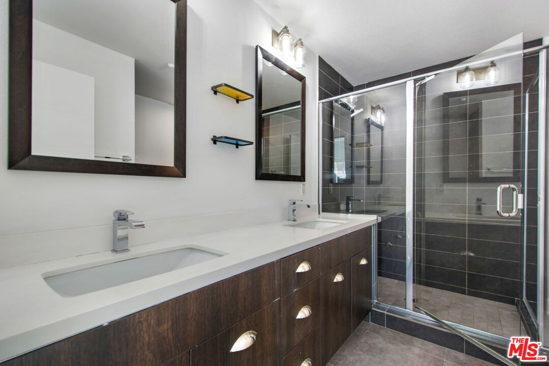2974 Ripple Place, Unit 203 Los Angeles, CA 90039 - Photo 21 of 29 a bathroom with a double vanity sink mirror and shower