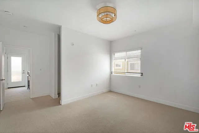 an empty room with closet area