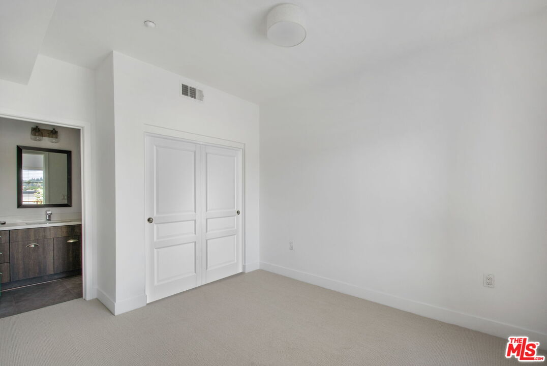 2974 Ripple Place, Unit 203 Los Angeles, CA 90039 - Photo 23 of 29 an empty room with closet area