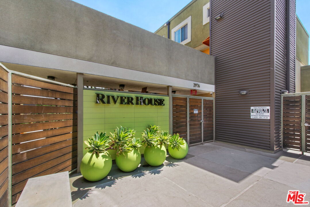 2974 Ripple Place, Unit 203 Los Angeles, CA 90039 - Photo 27 of 29 a front view of a house with a garden