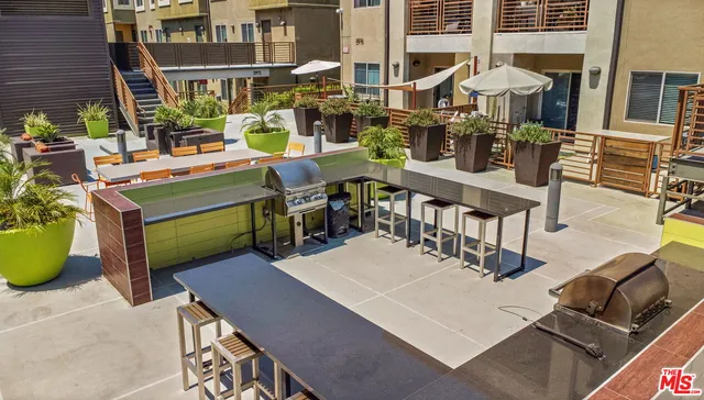 a view of a dining table and chairs in the patio