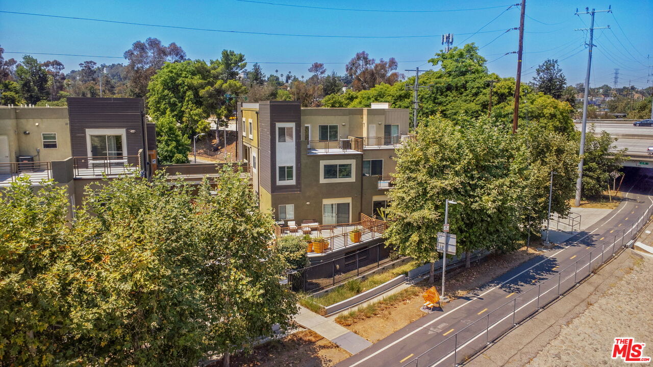 2974 Ripple Place, Unit 203 Los Angeles, CA 90039 - Photo 4 of 29 a view of a house with a small yard and potted plants