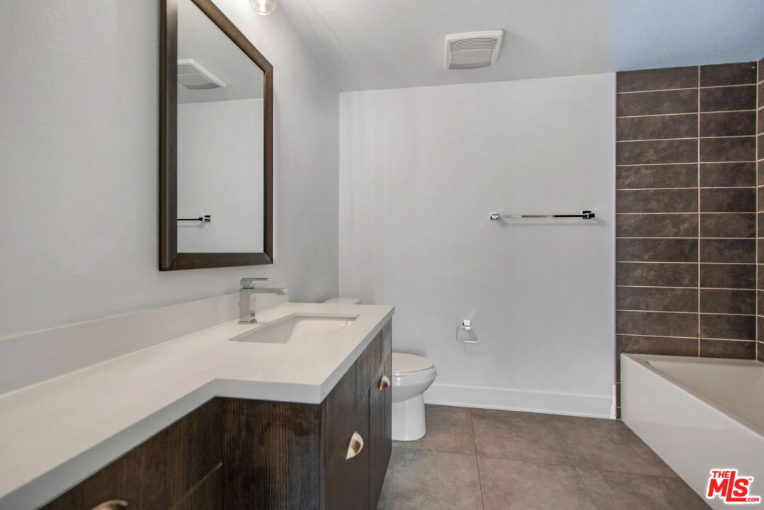 2974 Ripple Place, Unit 203 Los Angeles, CA 90039 - Photo 7 of 29 a bathroom with a sink a toilet and bathtub